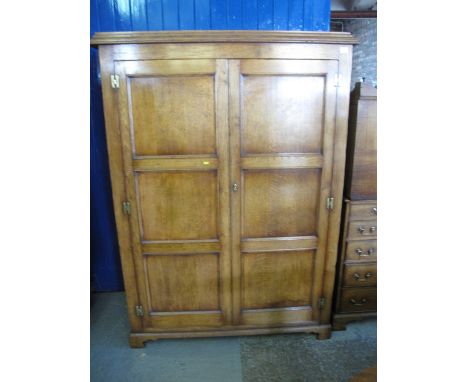 Good quality reproduction oak two door wardrobe on bracket feet. 