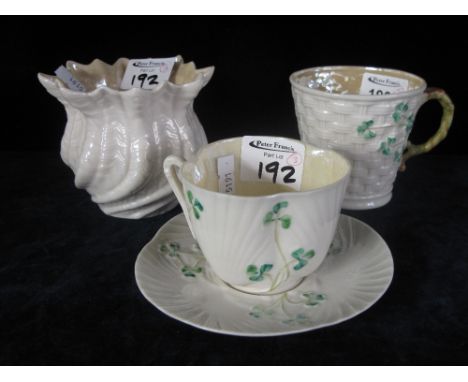 Three pieces of Belleek comprising mug, cup and saucer and vase, all with green printed marks to base. (3) CONDITION REPORT: 