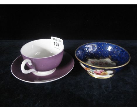Royal Worcester purple ground cup and saucer together with 19th century English porcelain small bowl with reserve panel decor