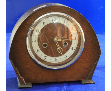 Mid 20th century oak arch topped two train mantle clock. 