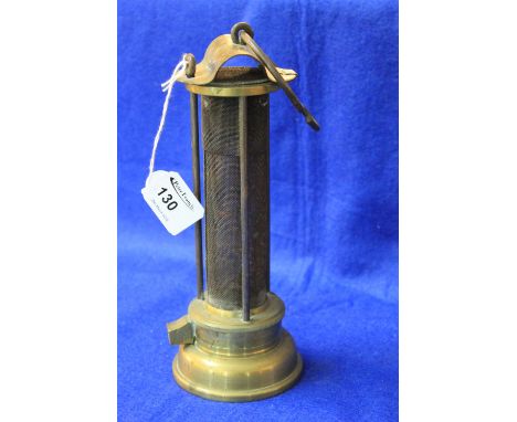 A Thomas & Williams of Aberdare brass Davey type miners safety lamp with gauze body. 