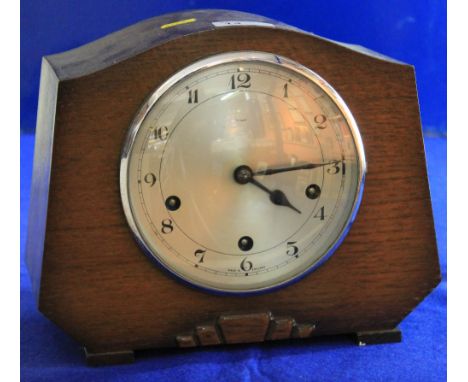 Mid 20th century Enfield oak three train mantle clock with silvered face. 