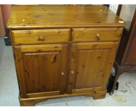 Modern pine two drawer sideboard on bracket feet. 