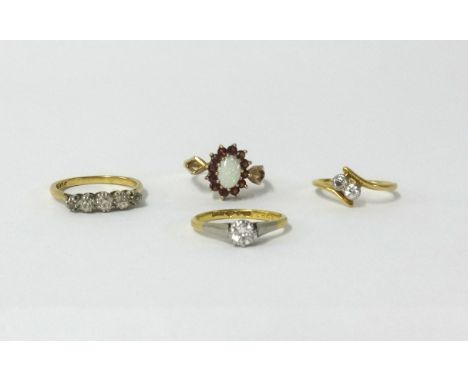 Four various diamond and opal set dress rings including two 18ct rings, approx 4.10gms and two 9ct rings approx 4.60gms (4).