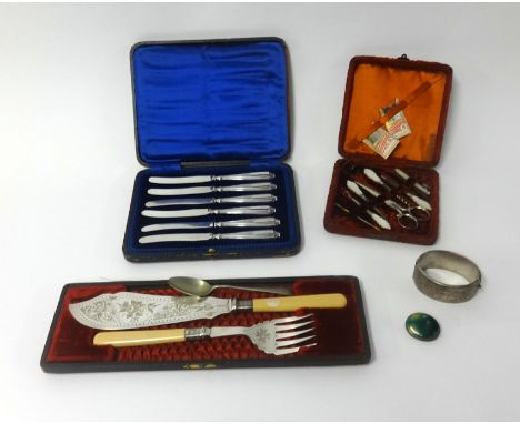 Four cased sets including a fitted nail set, fish set and cake knives together with a silver bangle and brooch.