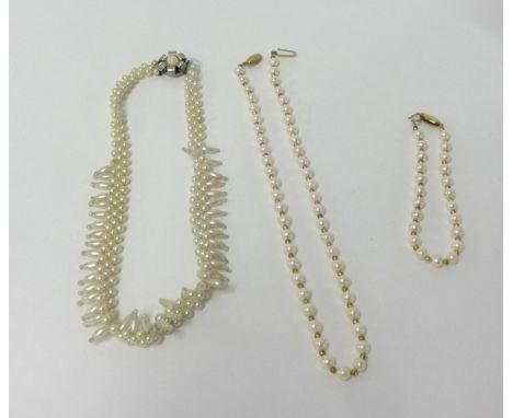A pearl necklace and matching bracelet with a 9ct gold clasp and another (3).