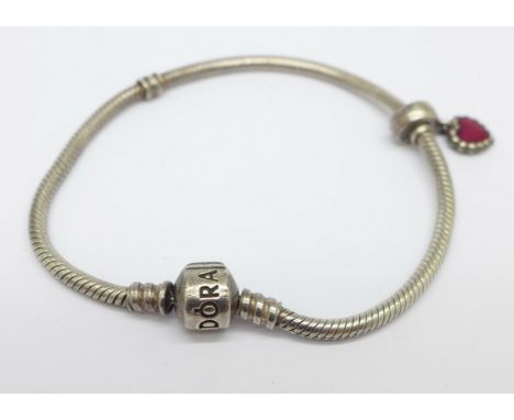 A silver Pandora bracelet with one charm 