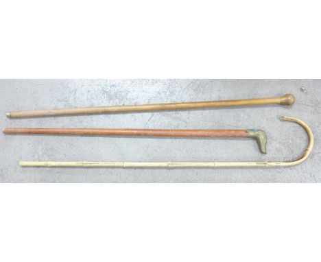 A bamboo walking stick, a walking cane and one other 