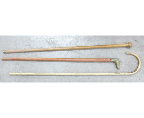 A bamboo walking stick, a walking cane and one other 