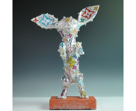 A striking mixed-media Chihuahua dog sculpture by Khalil Douisse, featuring a dazzling silver finish with multicolored Louis 