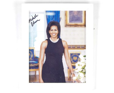 This framed portrait of Michelle Obama features the former First Lady elegantly posed in the White House's Blue Room. Signed 