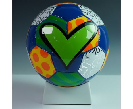 This striking limited edition ceramic soccer ball sculpture, signed, R. Britto, exemplifies the distinctive and vibrant style