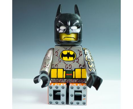 Whimsical and bold, this custom designer art toy features a stylized Batman figure reimagined with a fusion of pop culture an