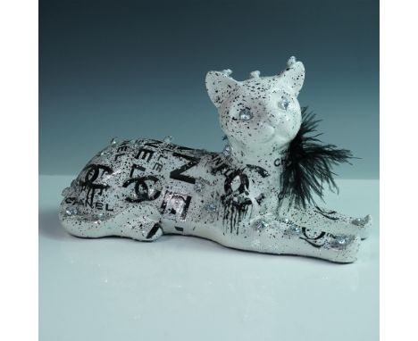 A striking mixed media sculpture by contemporary artist Khalil Douisse, depicting a stylized cat in a reclining pose. The pie