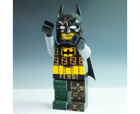 Unique custom-designed Batman figurine blending superhero themes with luxury fashion branding. This LEGO-style art toy featur