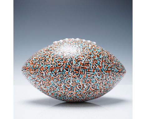 A unique, hand-painted full-size football featuring the signature abstract graffiti-style artwork of Abraham Onkst, known for