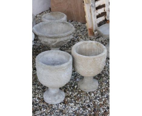 Pair of Reconstituted Stone Mayan Style Urn Circular Planters decorated with Aztec design on bases