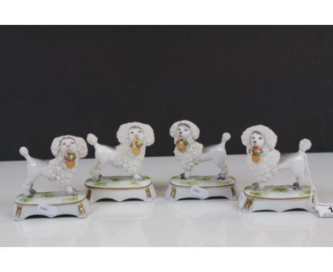 Two pairs of 19th Century ceramic Poodles with Baskets of Flowers &amp; Gilt detailing, one with Chelsea type Anchor maker ma