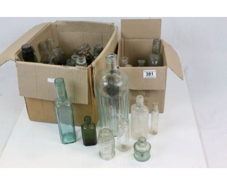Two boxes of vintage Glass Bottles to include Poison examples