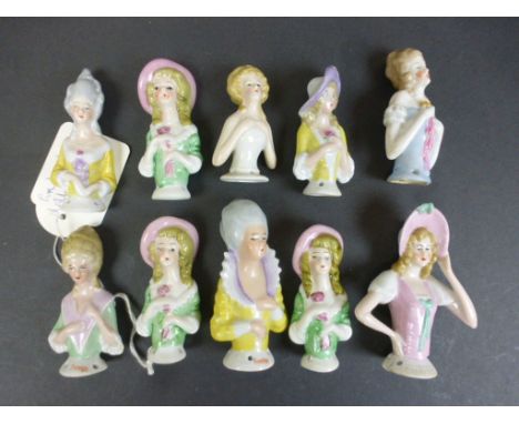 Ten Continental ceramic pin cushion heads modelled as woman, hand painted (10)