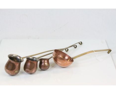 Set of Three Copper Graduating Hanging Spirit Measures ' Whiskey ', ' Rum ' and ' Brandy ' together with a Copper Ladle 