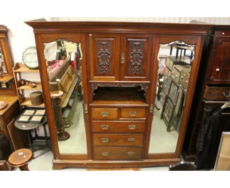 Large Late Victorian Mahogany Compendium Wardrobe comprising of a Central Bank of Two Carved Doors opening to reveal to Linen