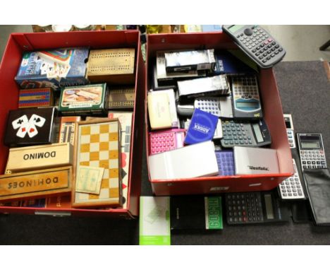 Box of vintage Calculators, many with original packaging and another box of vintage Cribbage boards