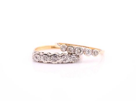Two five-stone diamond rings, one consists of five diamonds star-set on a high profile white metal mount, to a tapered yellow