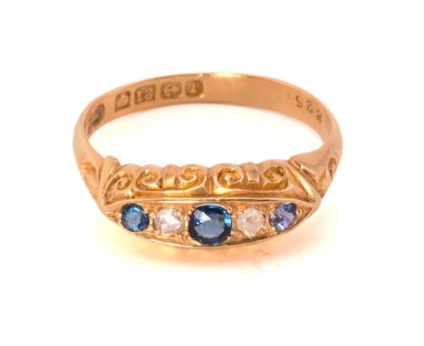 An Edwardian blue paste, sapphire and diamond five-stone ring, set with two blue faceted pastes and a sapphire, alternated wi