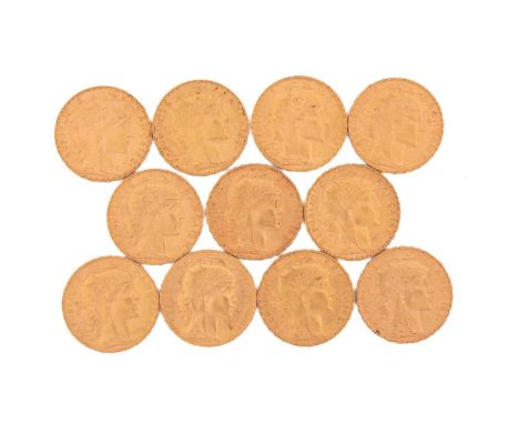 Eleven 20 French Franc gold coins, with a relief side portrait of Marianne on the obverse, a rooster on the reverse, dated fr