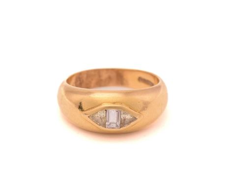 A baguette and trillion diamond three-stone gypsy ring in 18ct gold, featuring a centre vertical colourless baguette diamond,