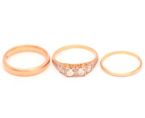 An Art Deco diamond ring and two wedding bands; the four-stone diamond ring comprises four old-European cut diamonds with an 
