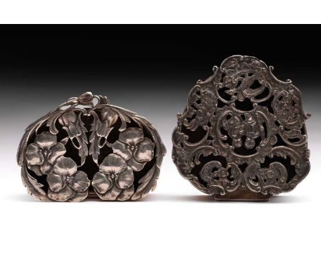 Two silver trinket boxes, comprising an Edwardian example the pierced hinged cover decorated with chased Pansy and leaf decor