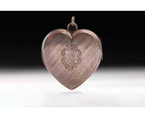 A heart-shaped Victorian vinaigrette; engine-turned to cover and base; the cover with a double monogram within a scrolling ca