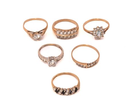 A selection of gem-set rings; to include a CZ half hoop ring in 14ct gold, London 1994, size T; a two-row CZ ring in 9ct gold