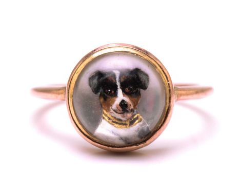 An Essex crystal ring depicting a Jack Russell Terrier, the reverse intaglio is done on a round rock crystal cabochon, mounte