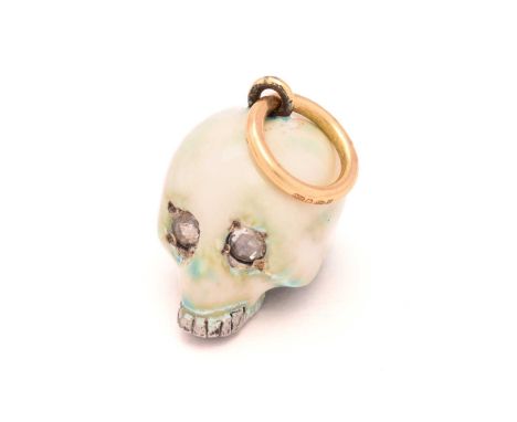 An enamel skull charm pendant with diamonds, a white and mottled teal enamelled silver hollow skull with eyes set with rose-c