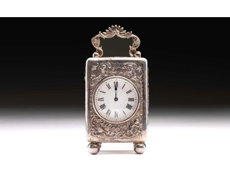 A late Victorian small silver-mounted carriage clock: circular white enamel dial; with Roman numerals, the case profusely cha