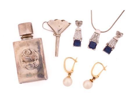 A silver cased perfume bottle with funnel, a pair of pearl drop earrings, a gem-set necklace and earrings en suite; The silve