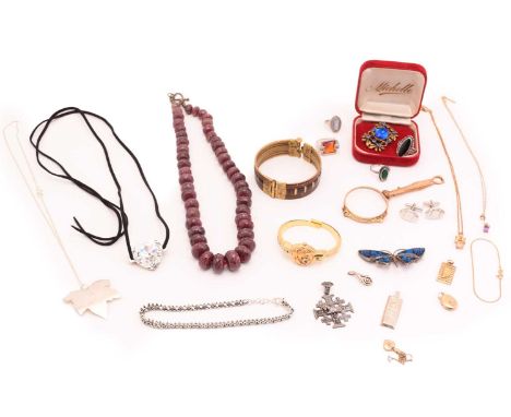 A mixed collection including examples of a faceted ruby bead necklace, a silver ingot pendant, a number of fine gold chains a