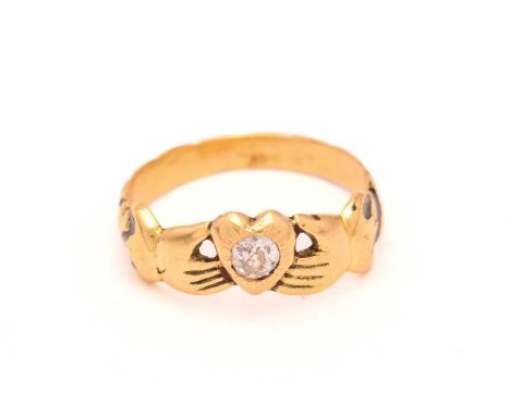 A Fede ring set with a diamond, depicting two hands holding a heart, symbolising faith and friendship, centred with an old-cu