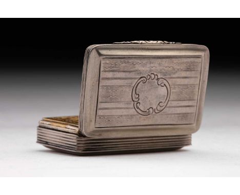 A Victorian vinaigrette; rounded rectangular with vacant scroll shaped cartouche around an engine-turned ground; foliate bar 