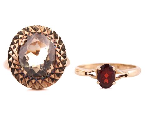 Two 9ct gold gem-set rings, one has an oval smoky quartz/citrine approximately measures 11.9 x 9.9 mm, double claws set on a 