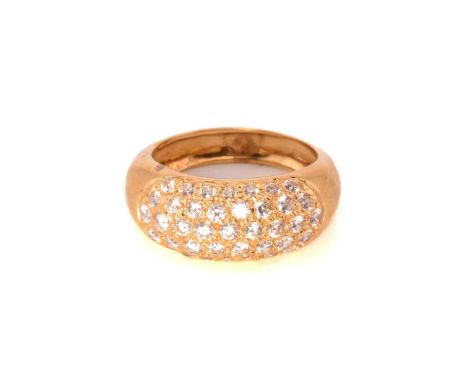 A pavé set cubic zirconia ring, encrusted with brilliant-cut CZs on a bombé mount in yellow metal, to a D-section shank, Ital