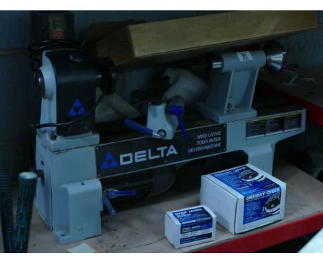 Delta Branded 240V 650 W Midi Lathe: Complete with 7 Robert Sorby Chisels, one way 4 jaw safety scroll chuck and similar step