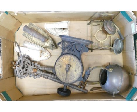 A mixed collection of metal ware items to include: Brass spirit kettle, large ornamental key set, scales, irons etc.