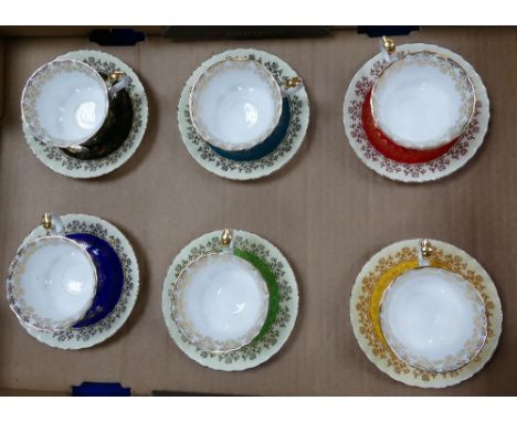 A collection of Royal Albert Harlequin patterned cups &amp; saucers: Six sets in various colours (1 tray).
