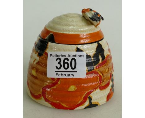 Clarice Cliff Beehive honey pot and cover : in the orange chintz pattern.