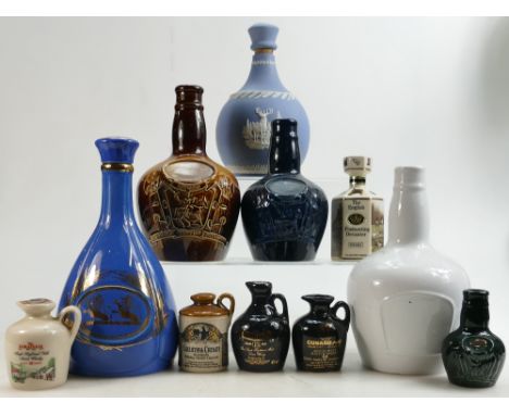 A collection of Ceramic Whisky Advertising Decanters to include: Wedgwood Blue Jasper item, Chivas, Whyte &amp; Makay etc