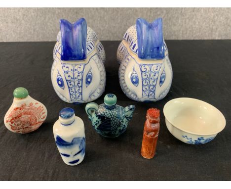 A miscellaneous collection of Chinese porcelain boxes and snuff bottles along with a soapstone seal. L.19cm (largest) 
